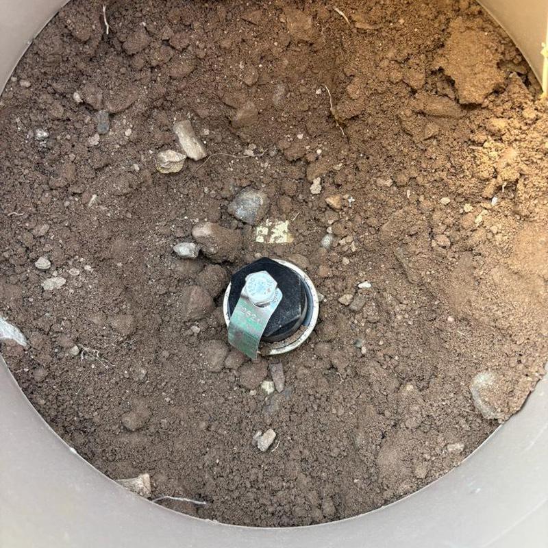 One inch P.R.V. valve with tan access box in soil