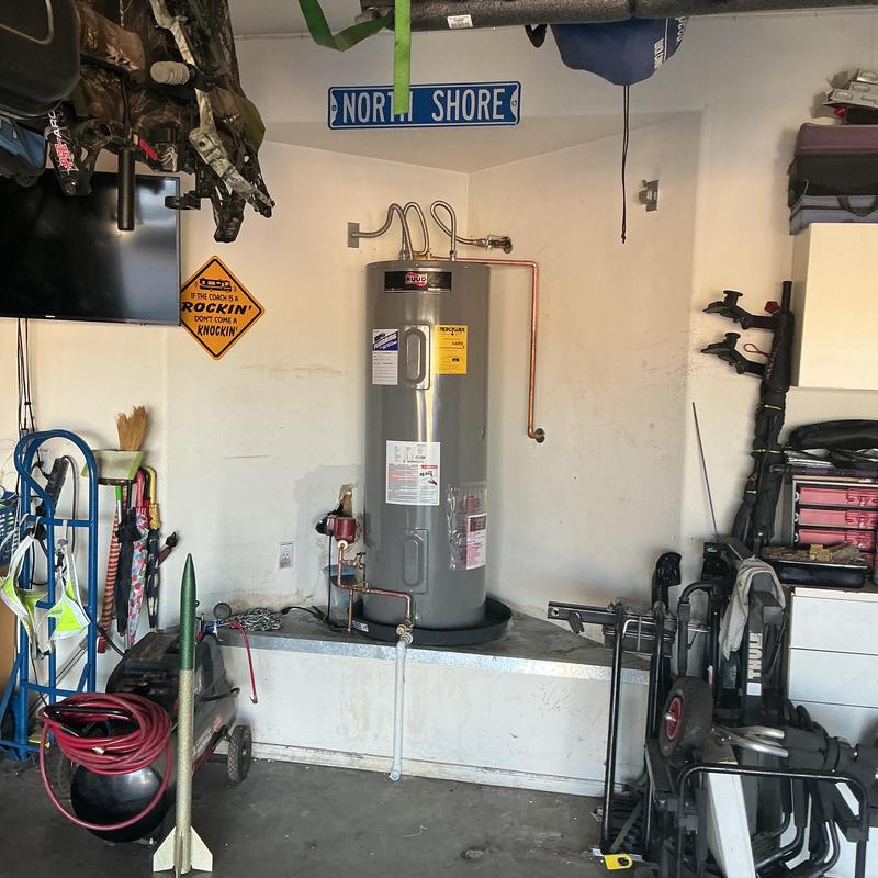 Electric water heater with repiped copper return line Electric water heater with repiped copper return line