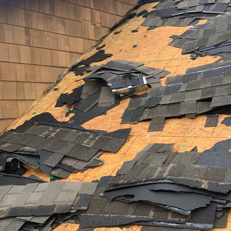 Roof shingles removal exposing plywood roof deck
