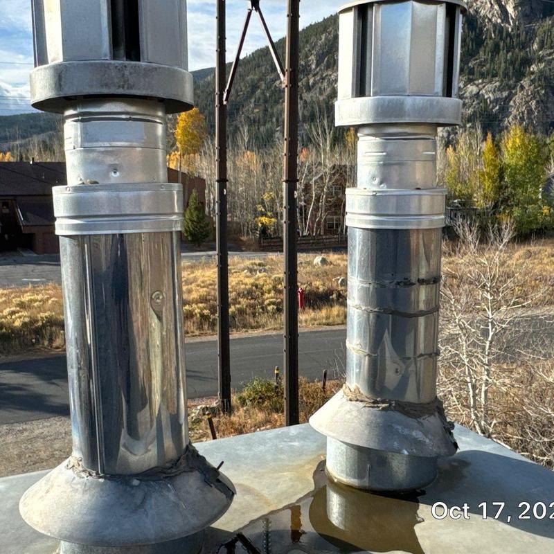 Chimney pipe flashing with sealant and vent caps