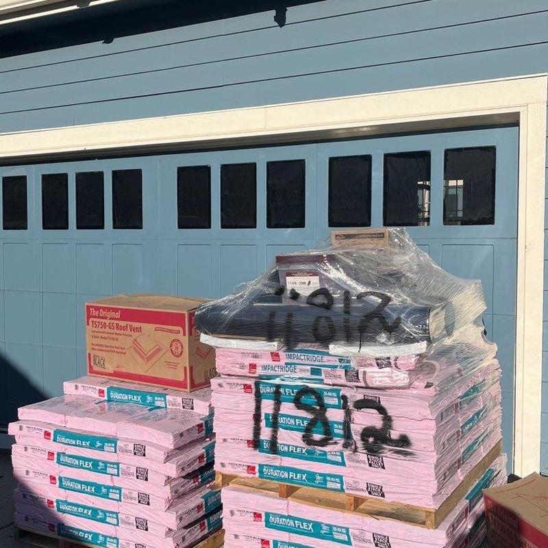 OC Duration Flex asphalt shingles stacked on pallets