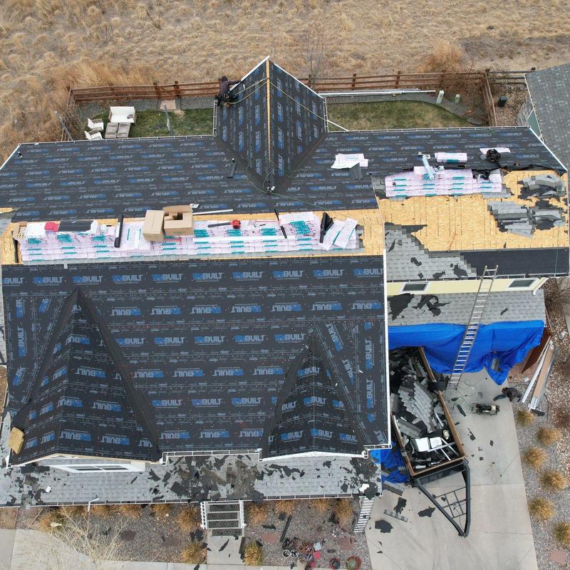 Asphalt shingles installation and rooftop prep in progress