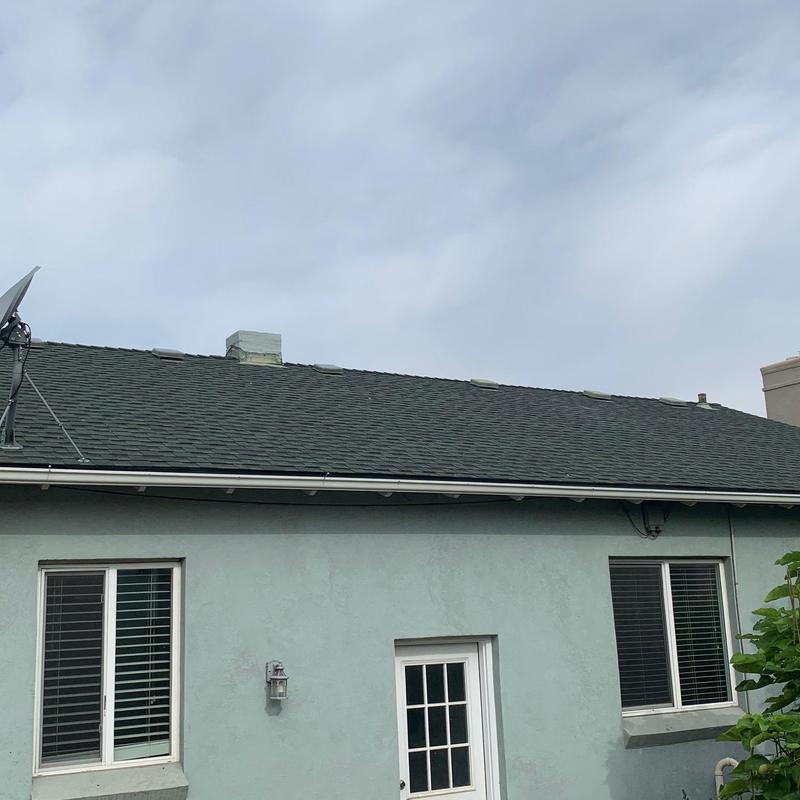Asphalt shingle roof installation on residential house