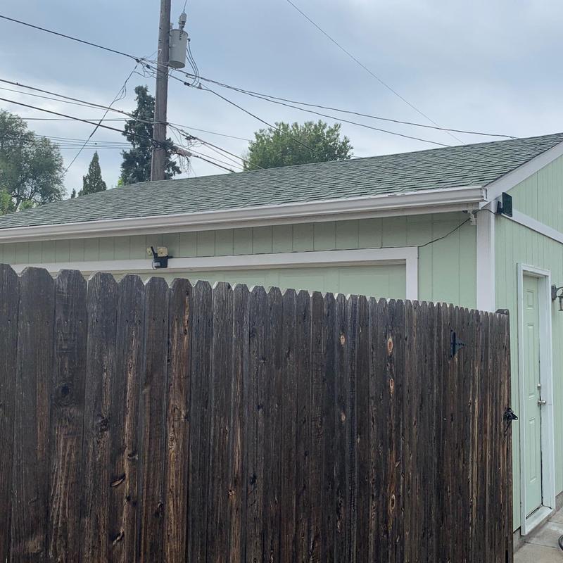 Asphalt shingle roof on detached garage in backyard
