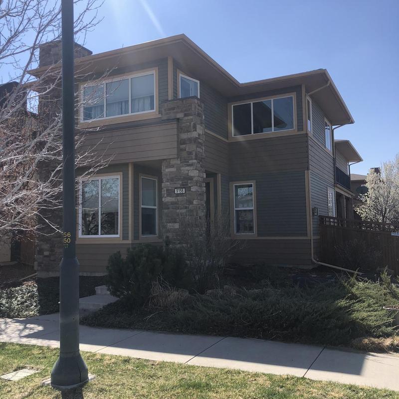 Asphalt shingle roof installation on multi-story house