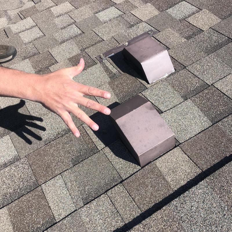 Asphalt shingle roof with ventilation covers