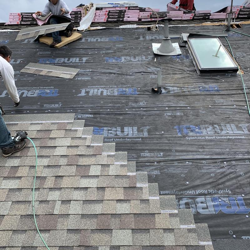Asphalt shingle roof installation with underlayment