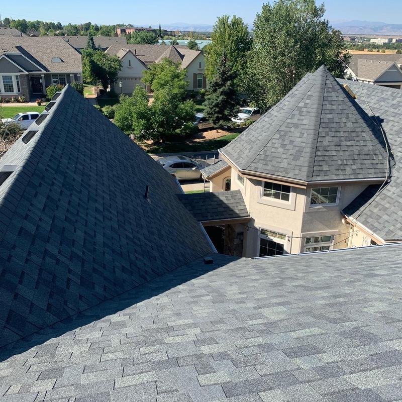 Asphalt shingle roof on multi-faceted luxury home