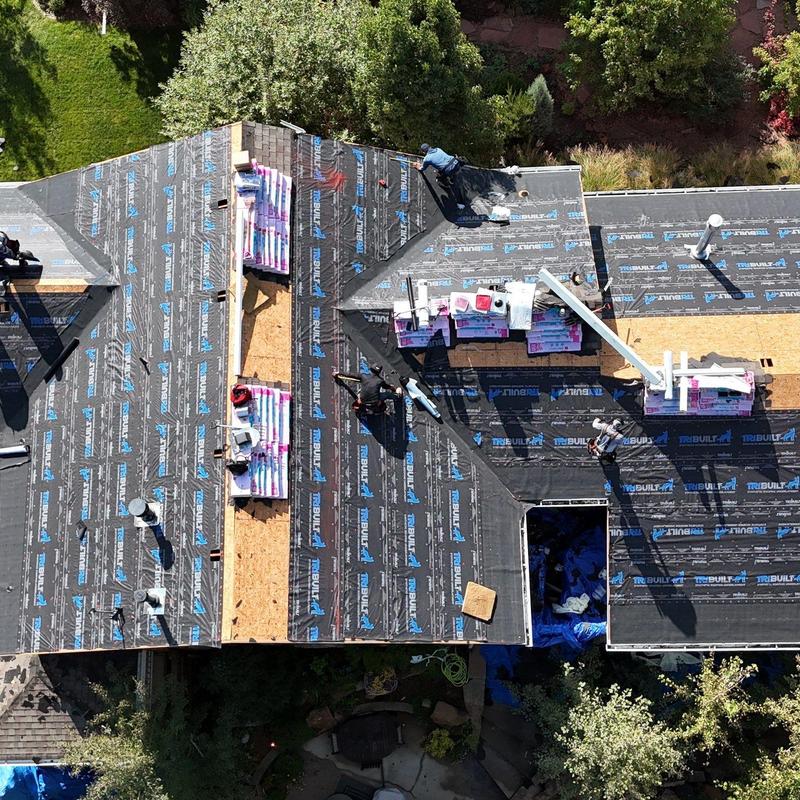 Asphalt shingle roof replacement with underlayment