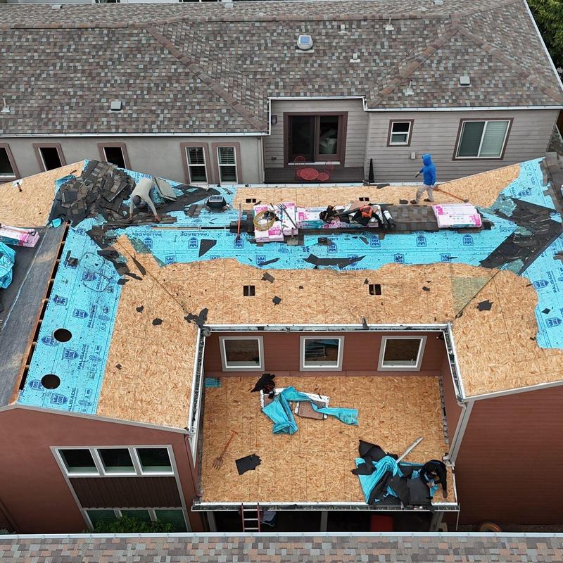 Asphalt shingle roofing replacement with insulation installation