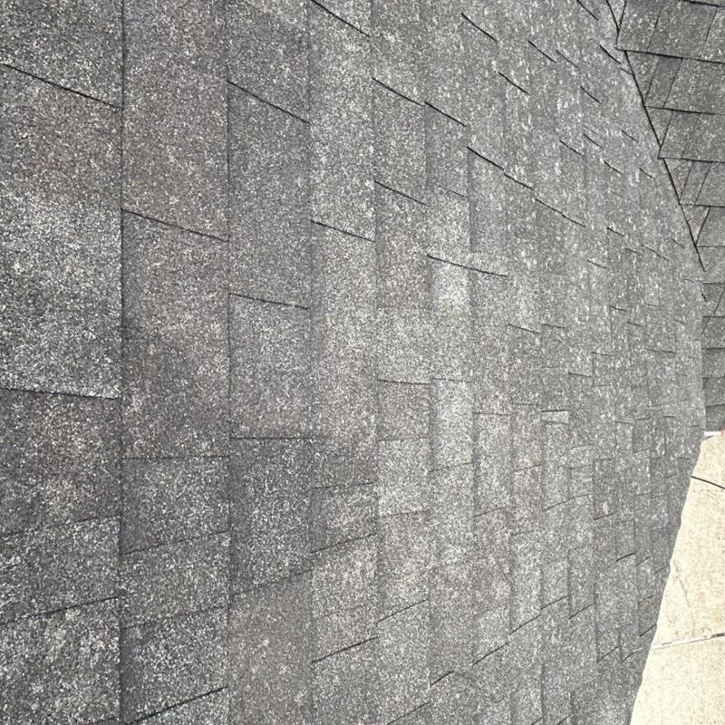 Asphalt shingle roof with hail damage marks