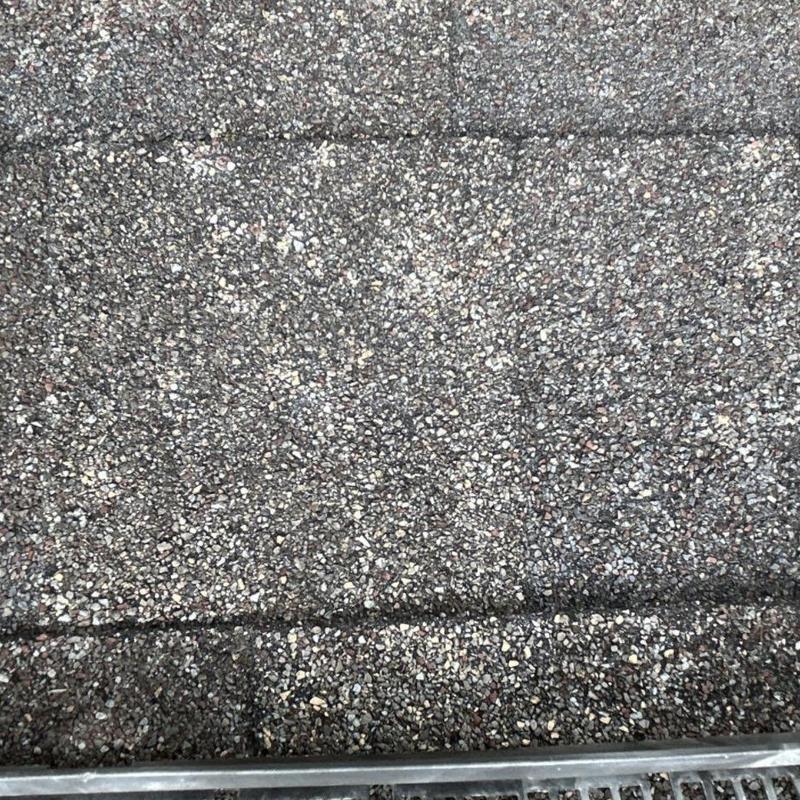Asphalt shingle roof with hail impact marks