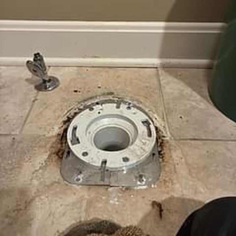 Closet flange installed on tiled bathroom floor