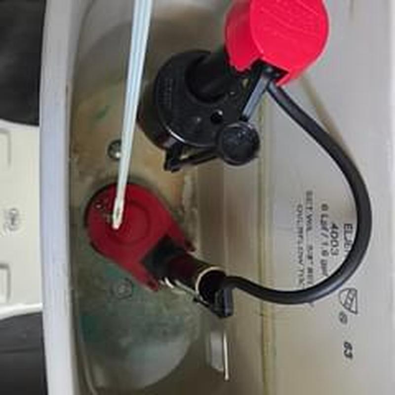 Toilet fill valve and flapper assembly inside tank