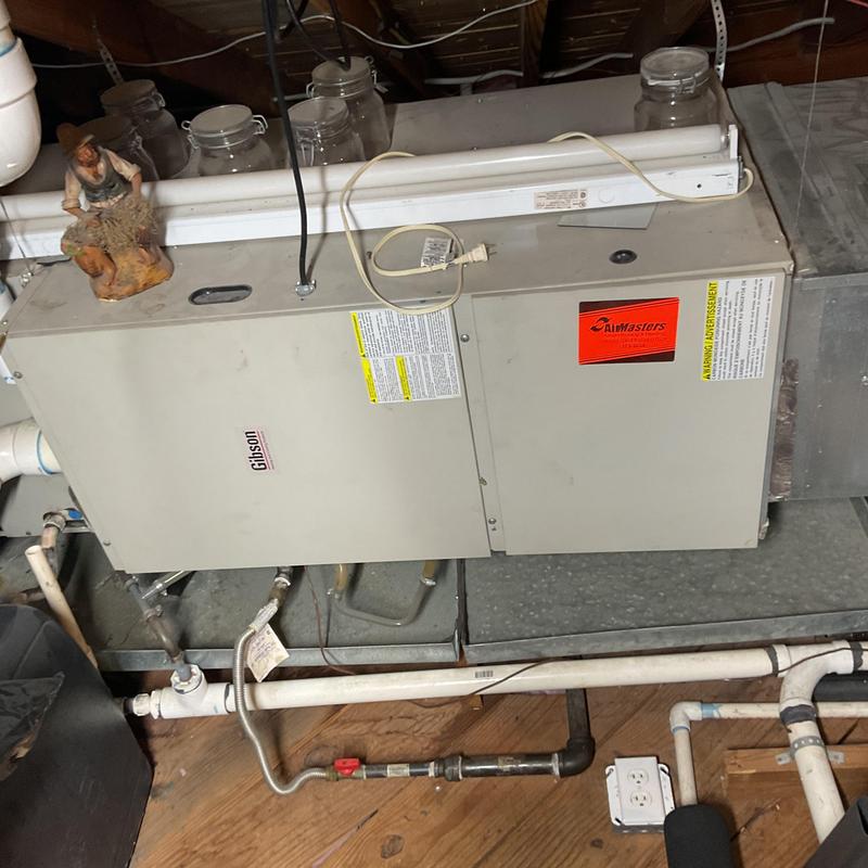 Furnace electrical components and pipes in basement