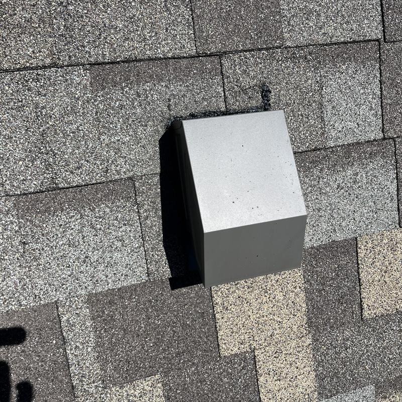 Roof vent on asphalt shingle roof during leak inspection