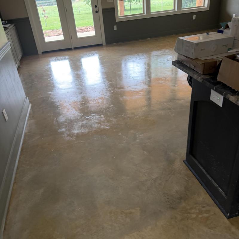 Polished concrete floor with window light reflection