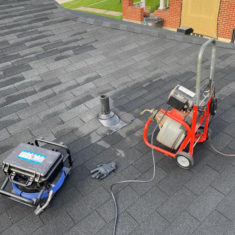 Roof vent cable and camera combo on shingled roof