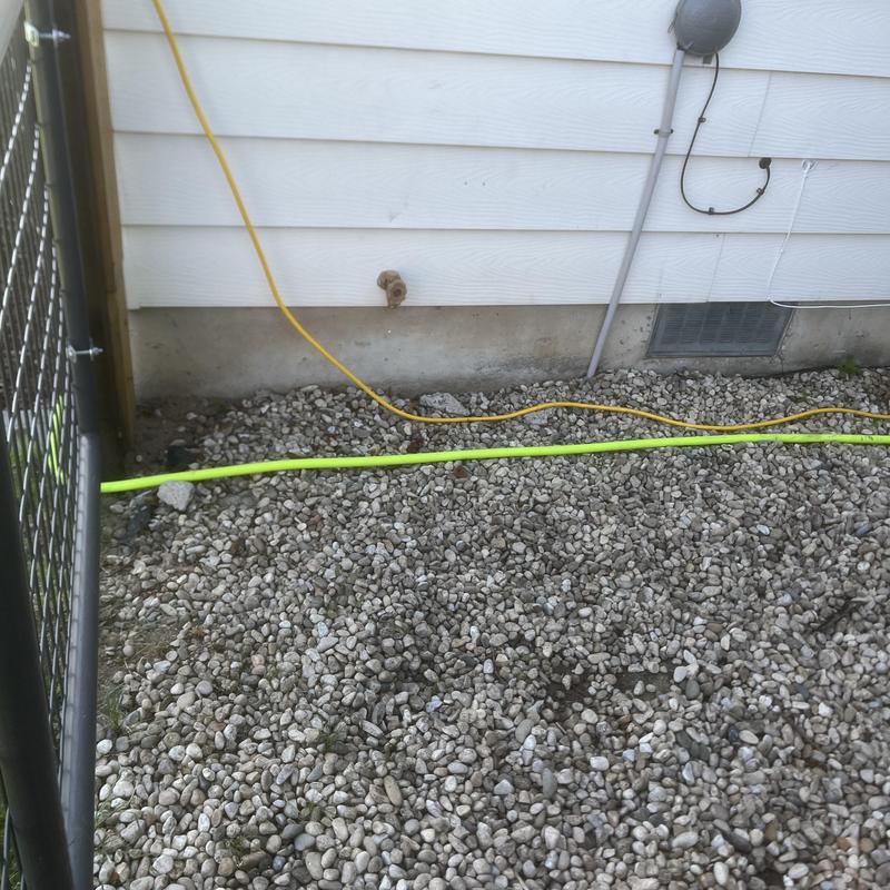 Hose bib faucet with service loops and concrete anchors