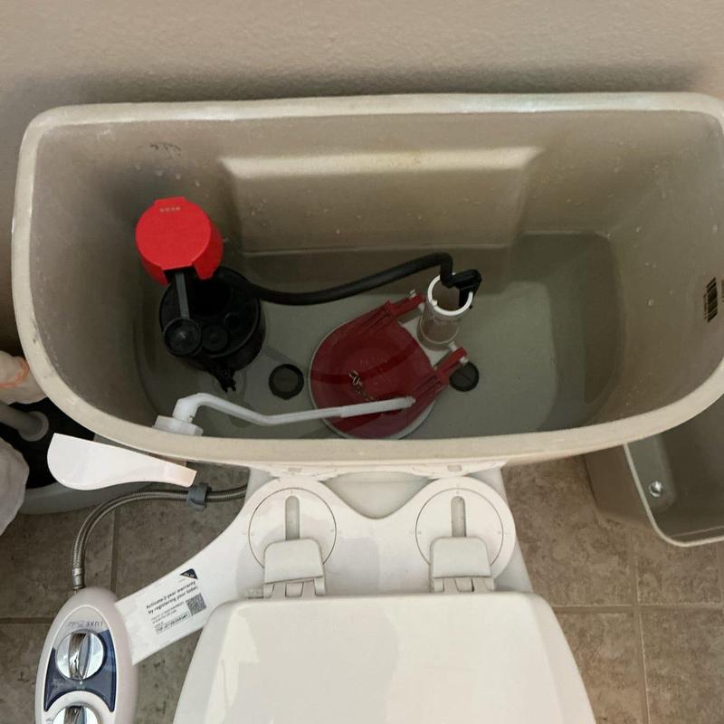 Toilet fill valve and flapper inside tank