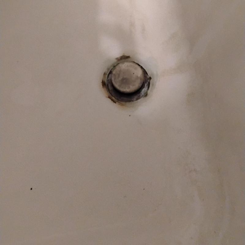 Bathtub drain stopper with corrosion and stains