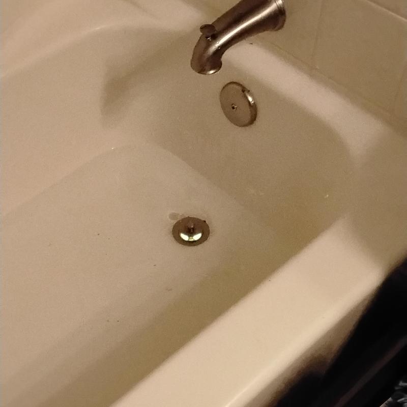 Brushed nickel tub spout and drain installation