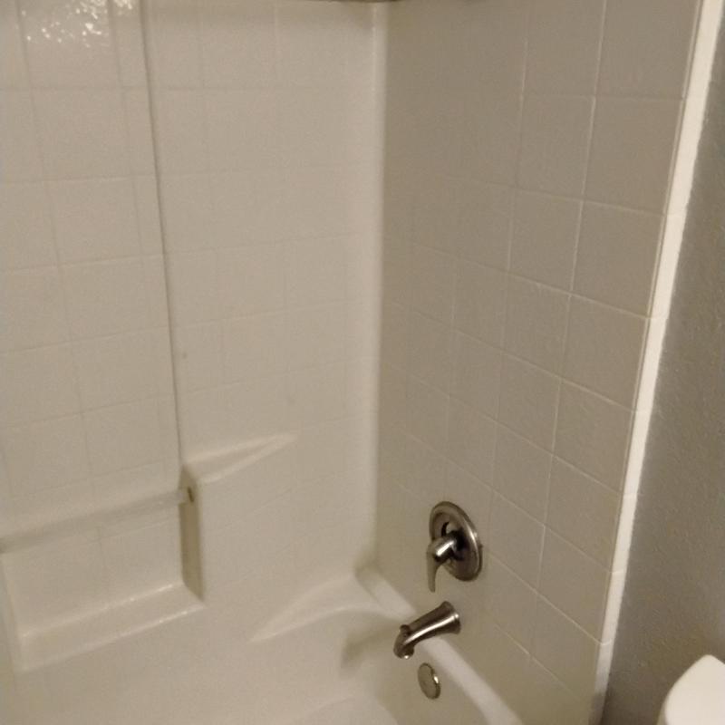 Twist and turn drain with brushed nickel tub spout and shower head