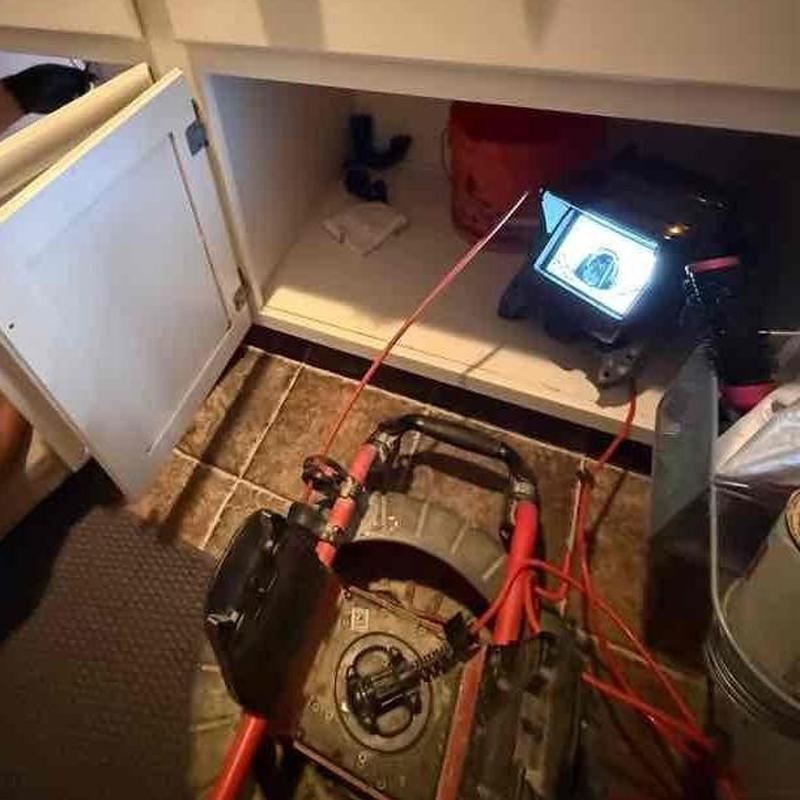 Drain line inspection with drill snake and monitor under sink