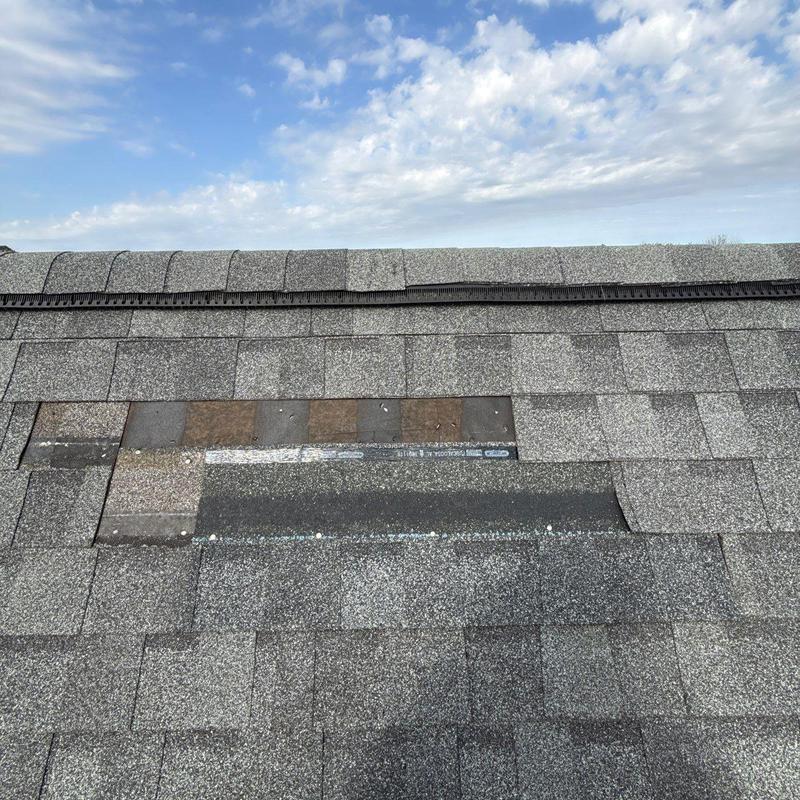 Asphalt shingles with hail damage and wear