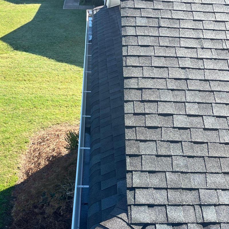 Asphalt shingles and ridge vent with gutter system