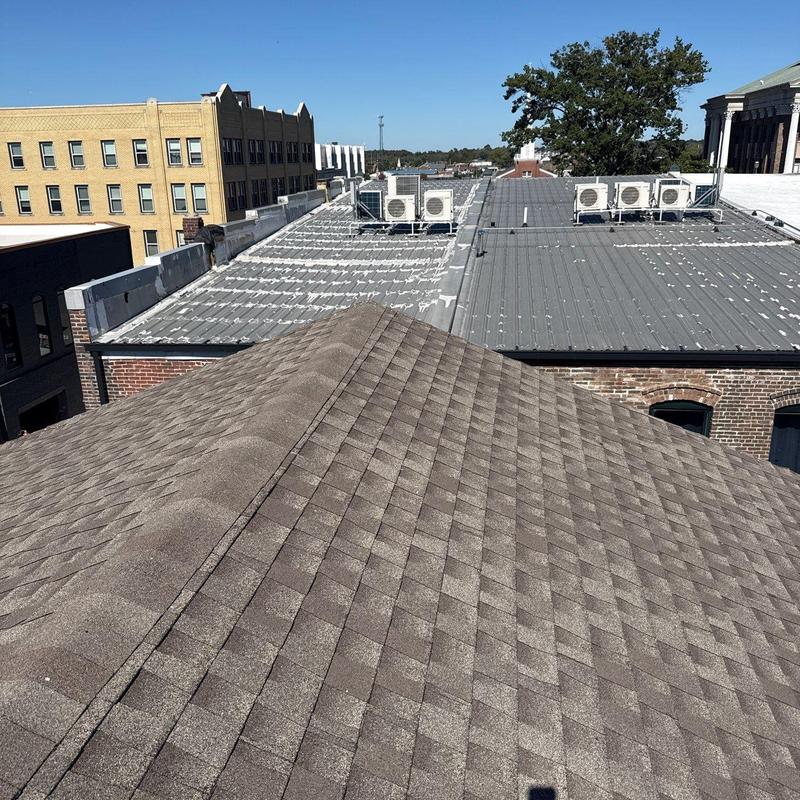 Commercial roof shingles inspection with hail damage
