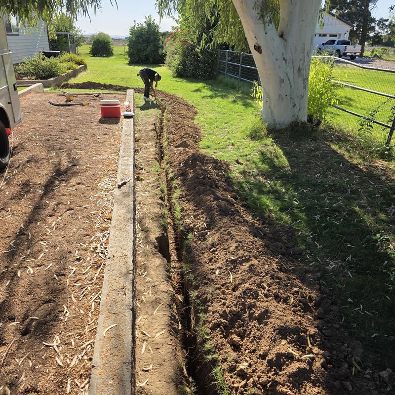 Polyethylene gas pipe trench excavation in yard