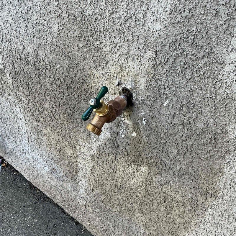 Half-inch hose bib installed on exterior wall