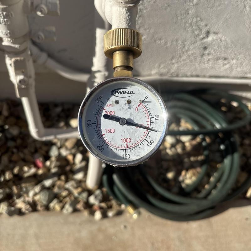 Pressure regulator valve pressure gauge reading outdoors Pressure regulator valve pressure gauge reading outdoors