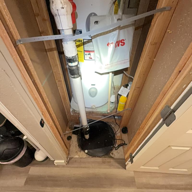 Sewage ejector pump with discharge pipe installation