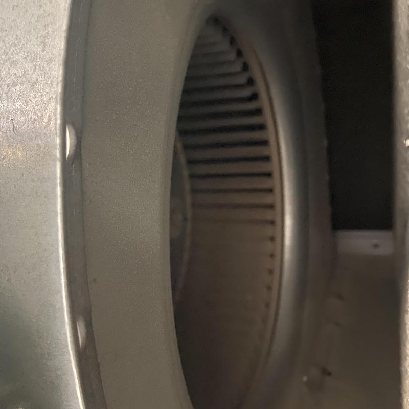 HVAC blower wheel inside metal casing close-up