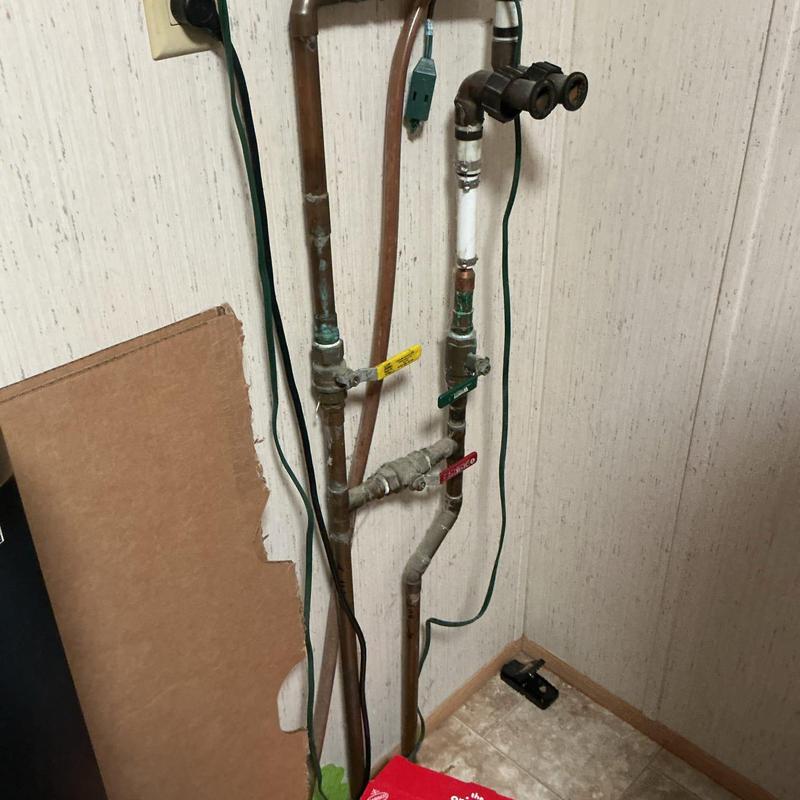 Water softener supply pipes with valves and fittings