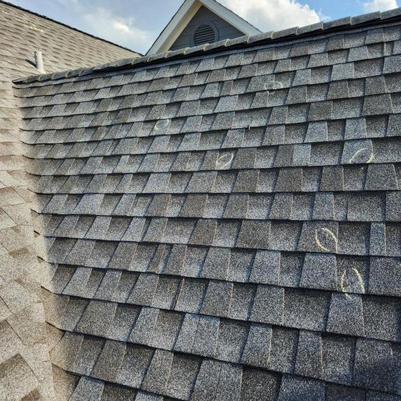 Asphalt shingle roof with chalk markings for inspection