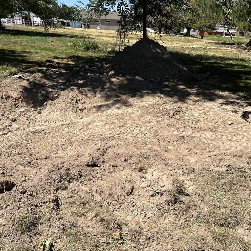 Septic tank excavation site with dirt pile