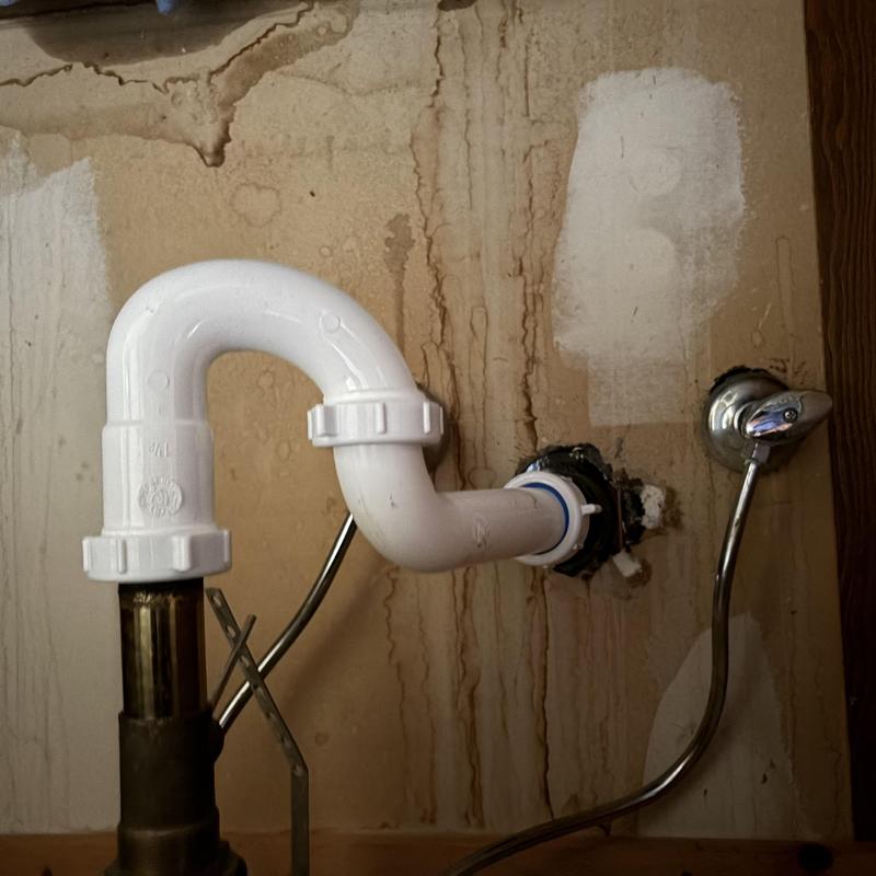 Sink drain trap and water supply valve with wall stains