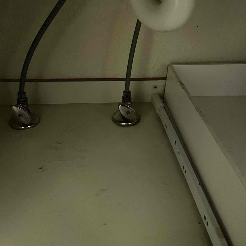Angle stops and supply lines under cabinet leak inspection