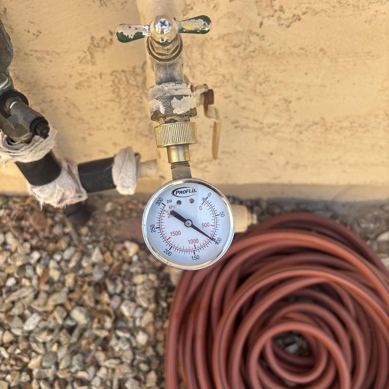 Water pressure gauge on outdoor hose bibb valve Water pressure gauge on outdoor hose bibb valve