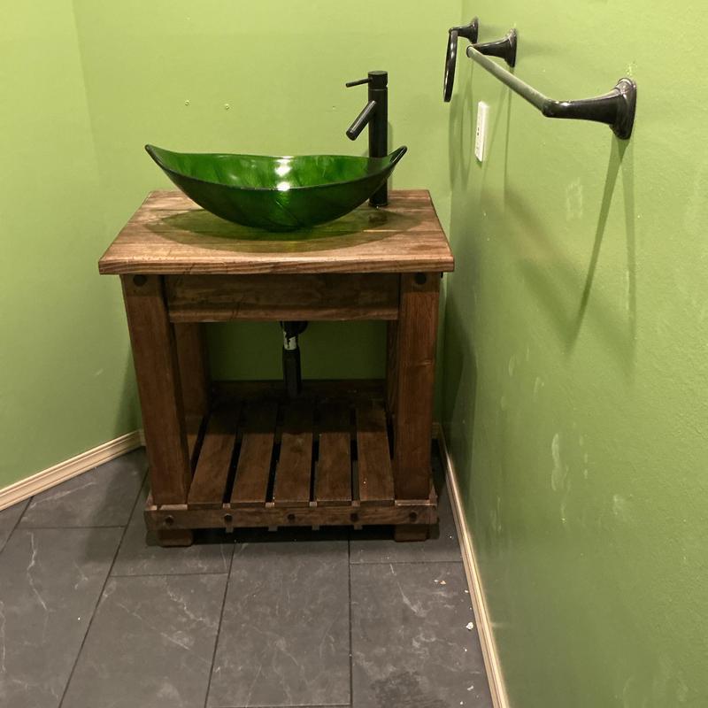 Vessel sink basin and drain installation on wood vanity