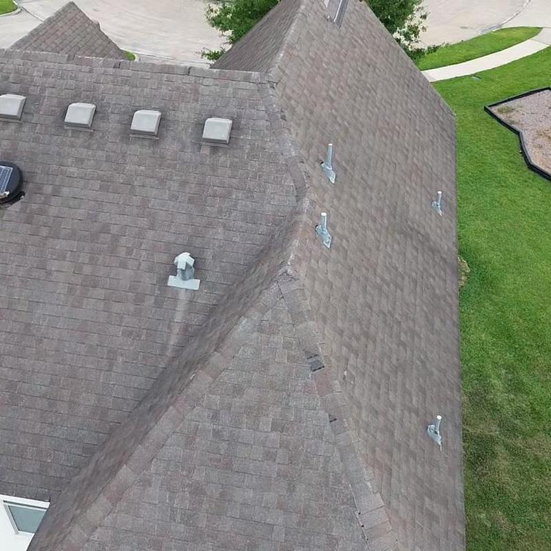 Asphalt shingle roof inspection for leaks and wind damage