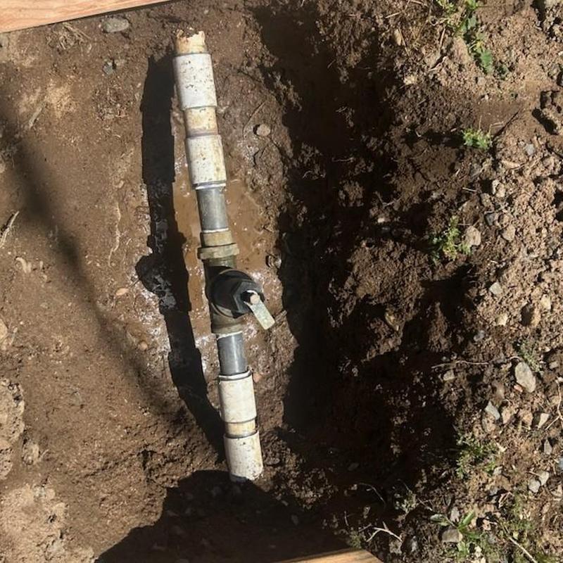 1.25-inch pressure regulator on underground PVC water line