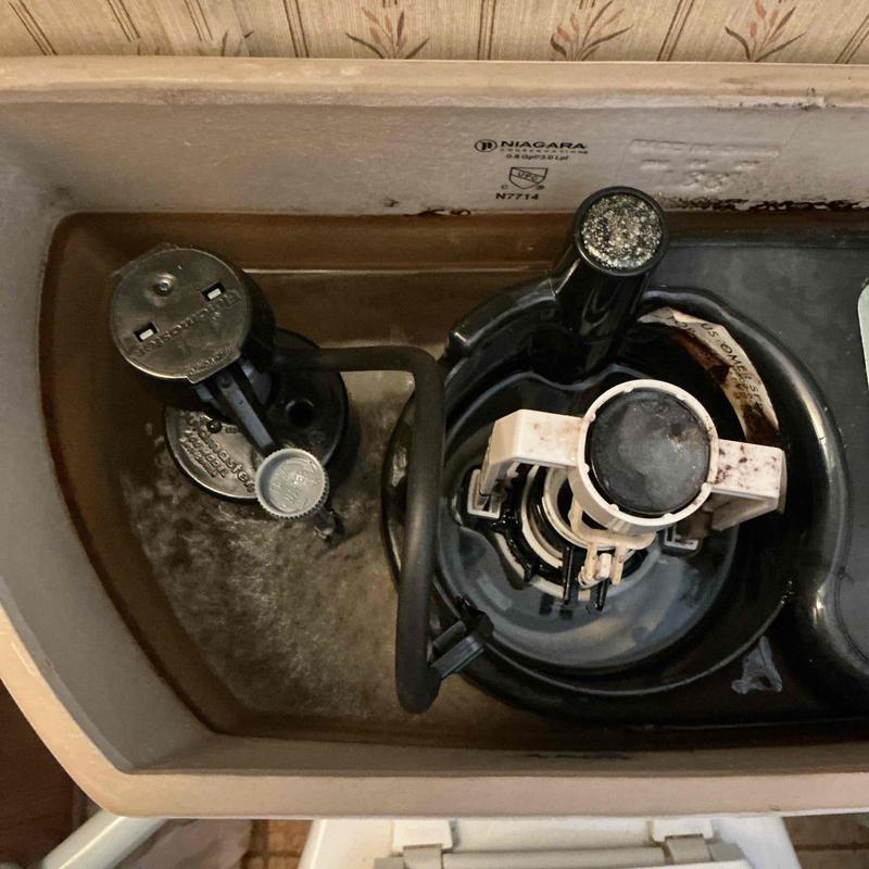 Toilet fill valve and flush mechanism inside tank