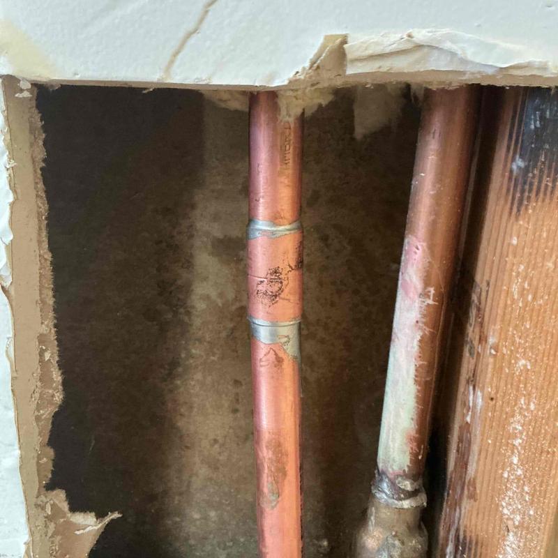 Type L copper pipe section with new fittings installed