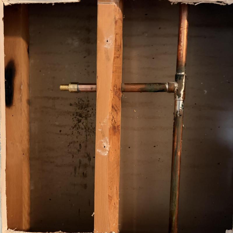 Copper pipe and hose bib installation inside wall cavity