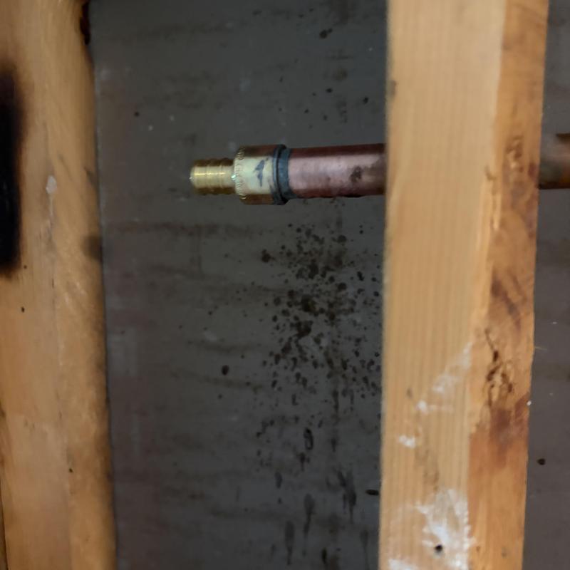 Copper pipe with new hose bib fitting inside wall cavity