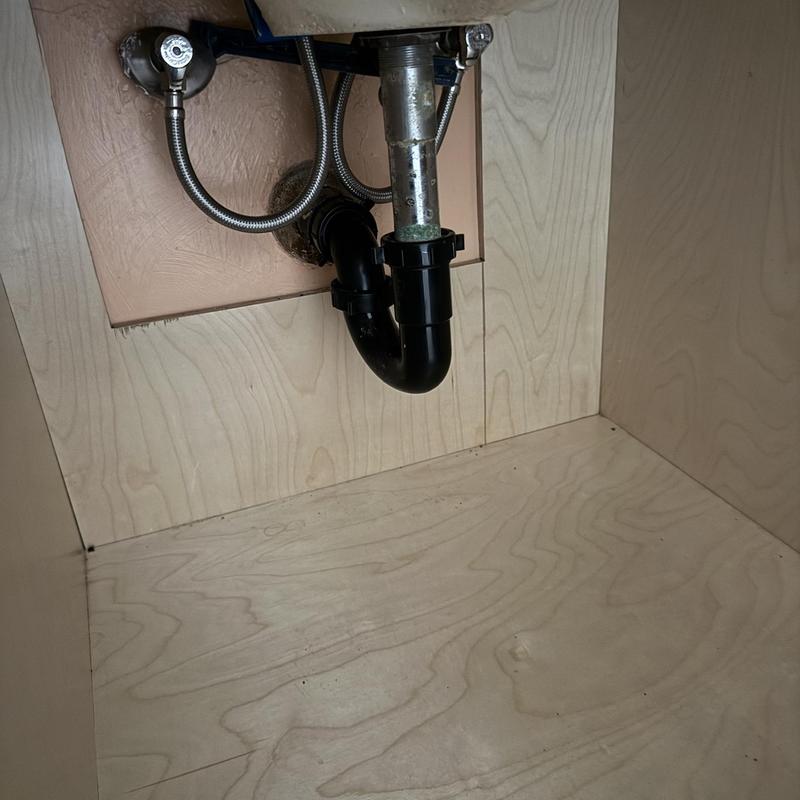 P-trap drain pipe under bathroom sink cabinet P-trap drain pipe under bathroom sink cabinet